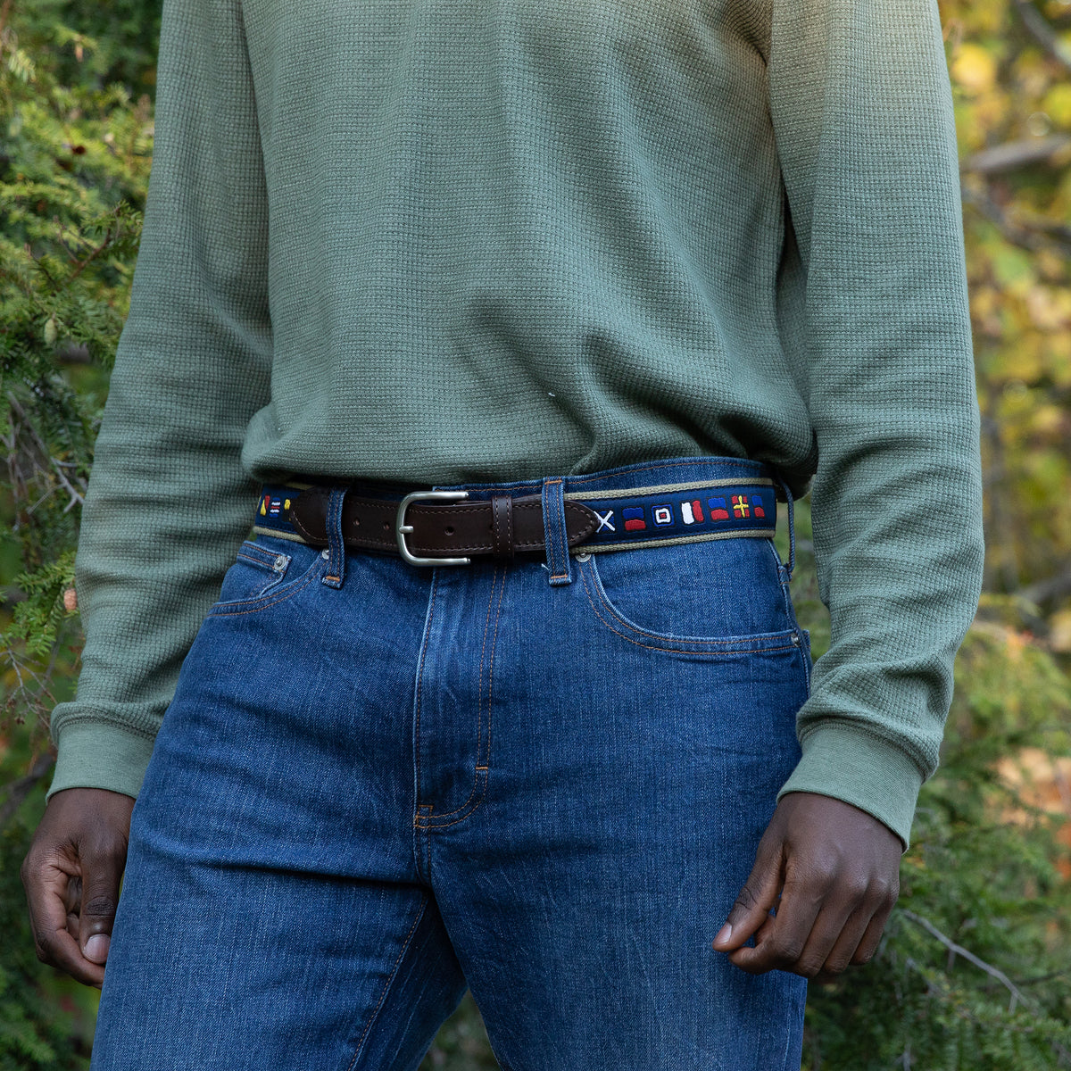 A man wearing the It's 5 o'clock Somewhere Ribbon Belt from Belted Cow Company