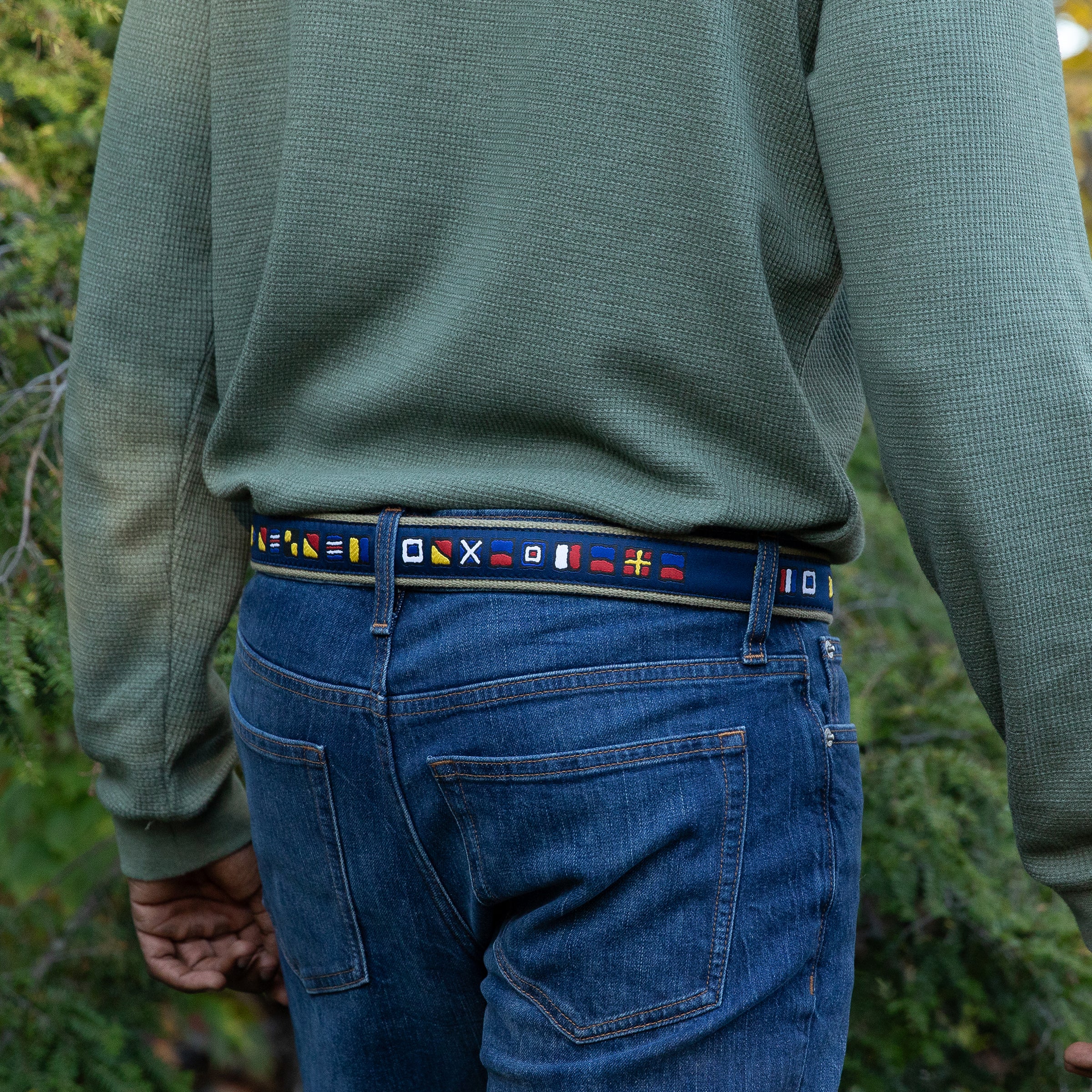 A man wearing the It's 5 o'clock Somewhere Ribbon Belt from Belted Cow Company