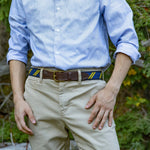 Man wearing Classic Repp Stripe Ribbon Club Belt in Navy and Yellow from Belted Cow Company Thumbnail