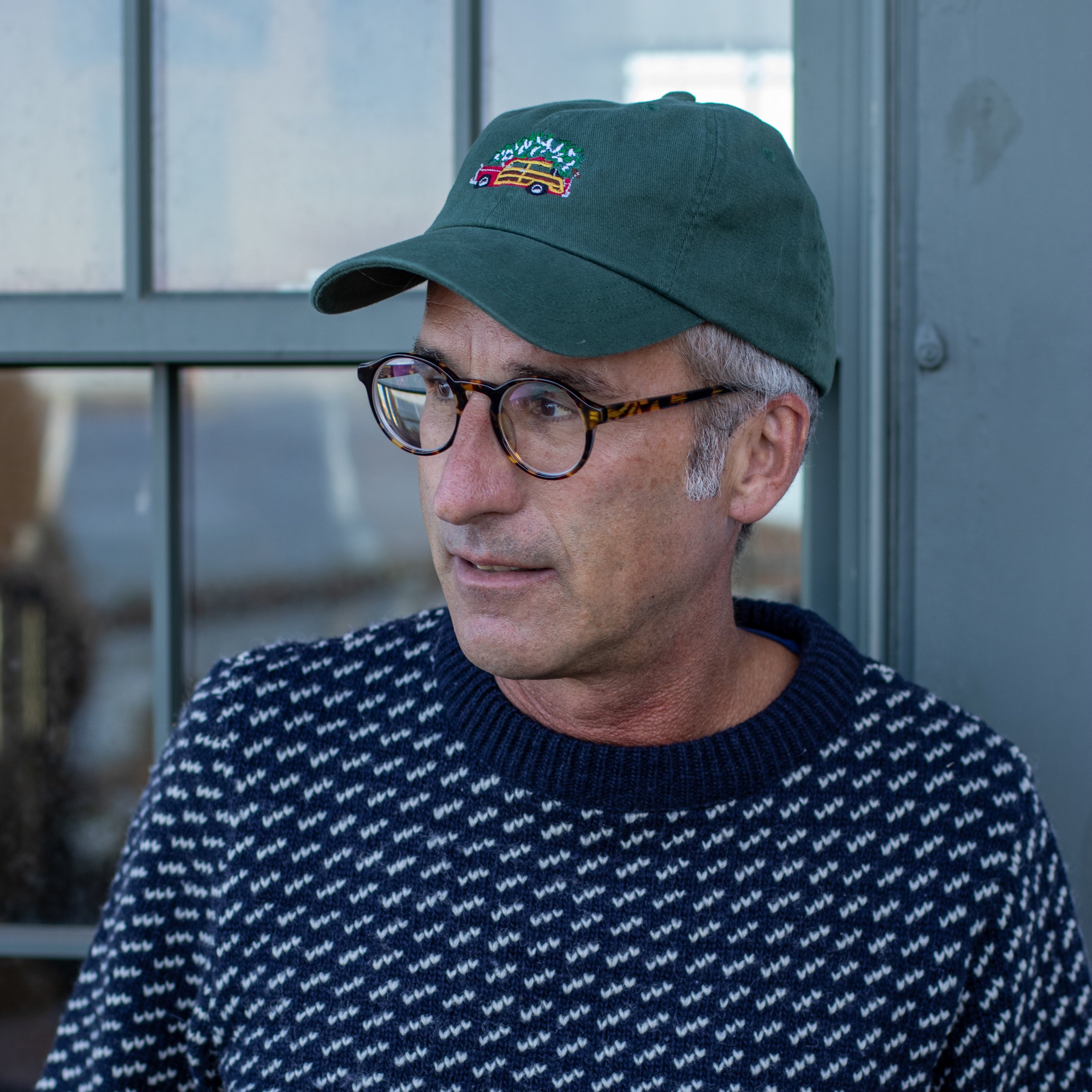 Man wearing Woodie & Tree Christmas Dad Hat from Belted Cow Company